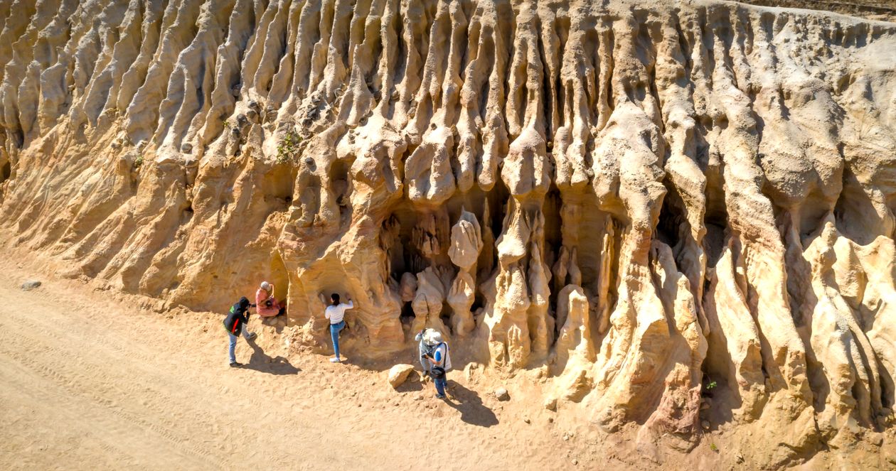 People Exploring Rocks People Exploring Ancient Rocks in Desert · Free Stock Photo