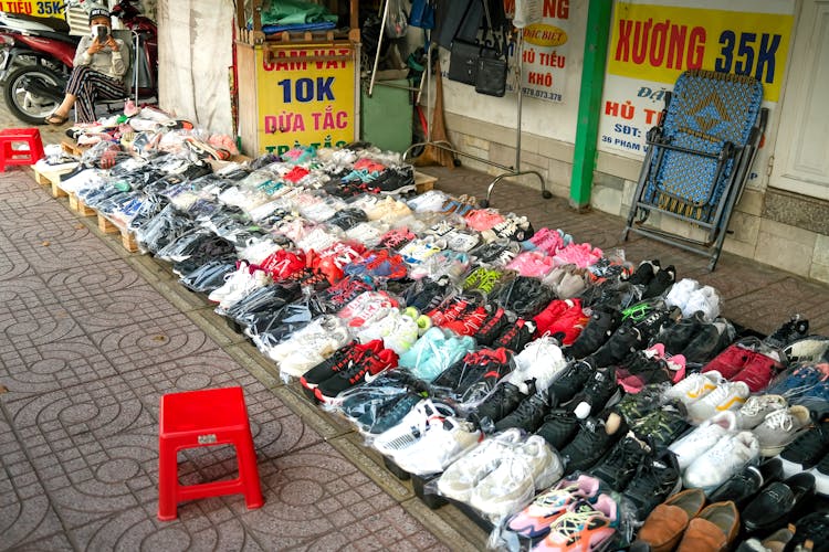 Assorted Sneakers On Sidewalk