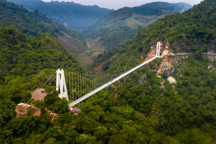 Suspension Bridge In Green Mountains Landscape