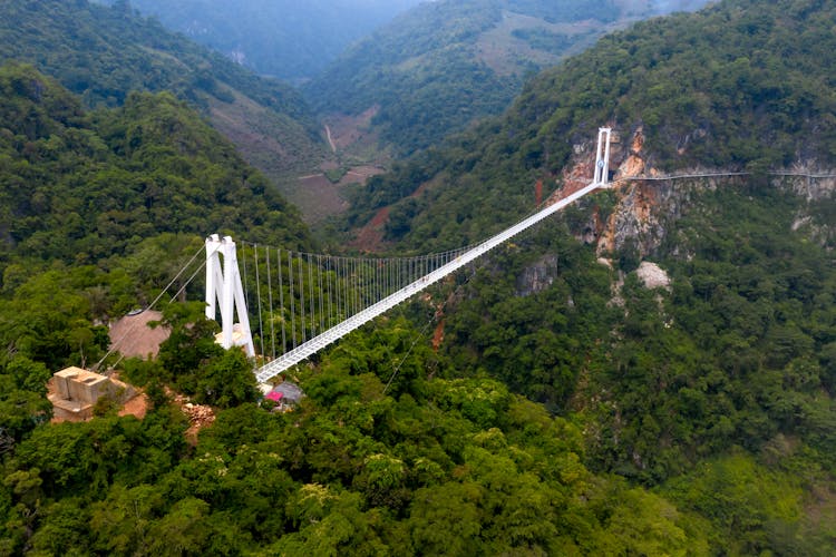 Suspension Bridge In Green Mountains Landscape