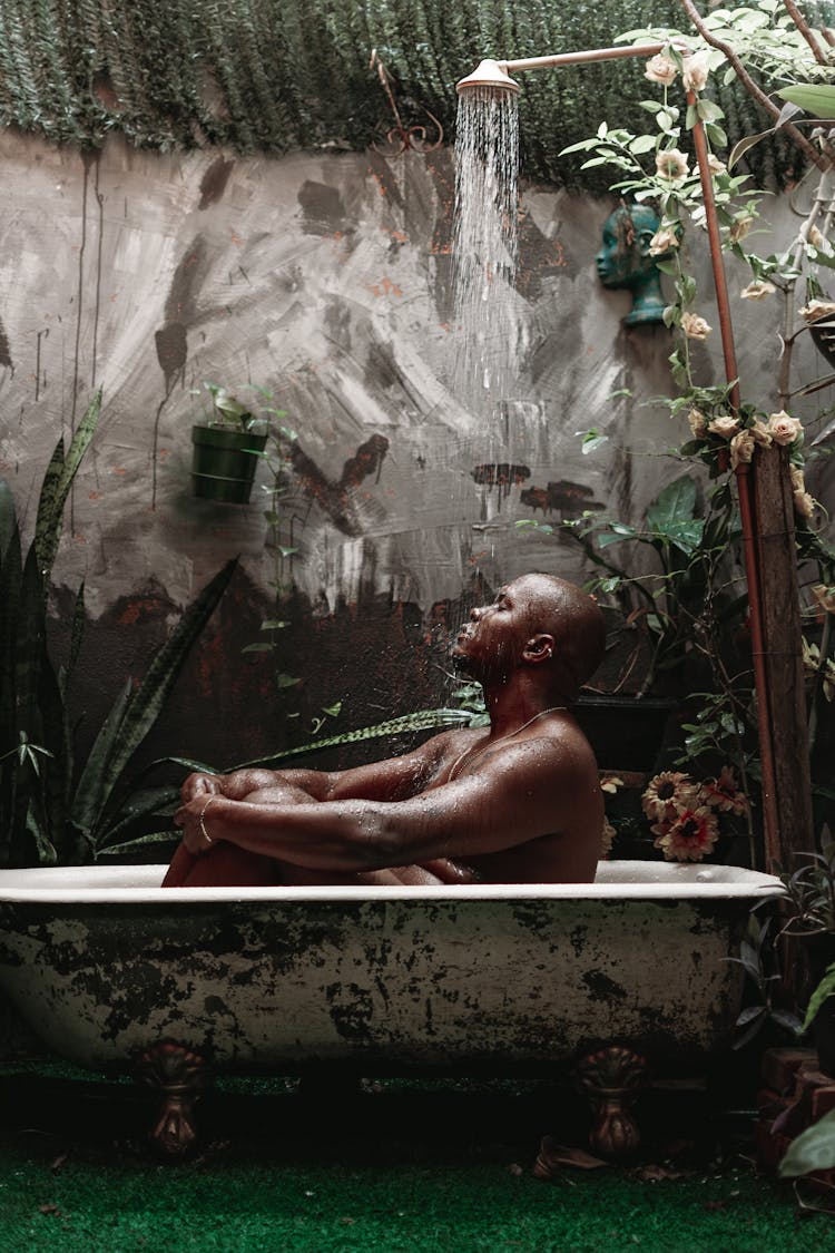 Shirtless Man Sitting In Bath 