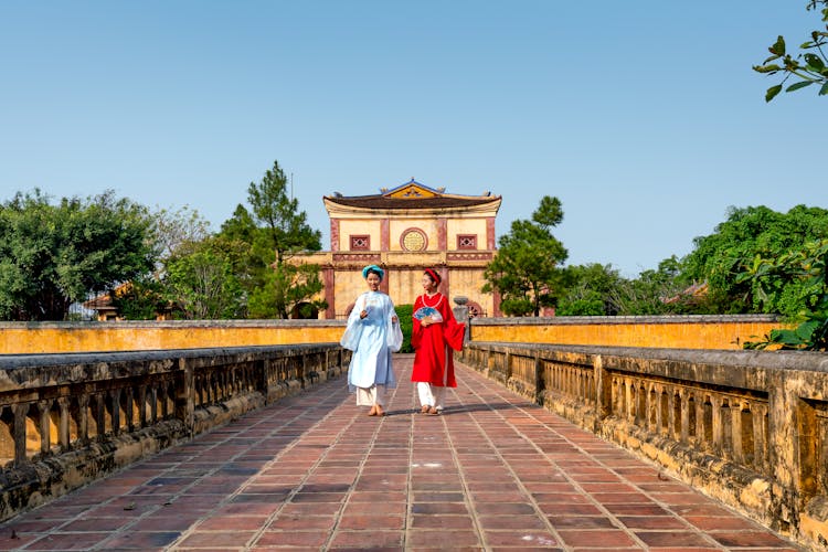 Vietnamese Women Walking On Bridge