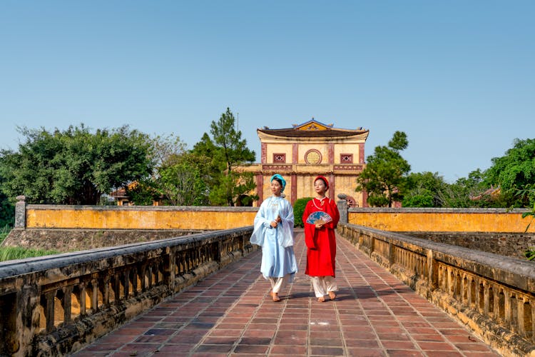 Models Walking On The Bridge Of The Temple Of Wisdom In Vietnam