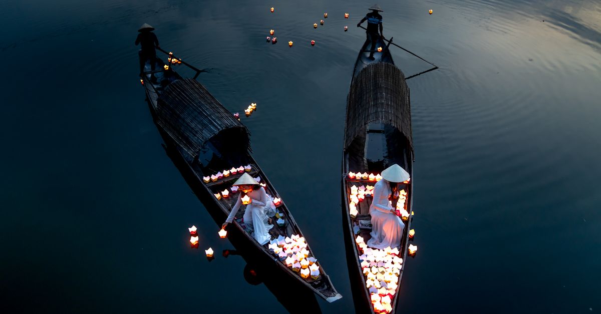 Lantern-lit boats on the river at Hoi An in Vietnam