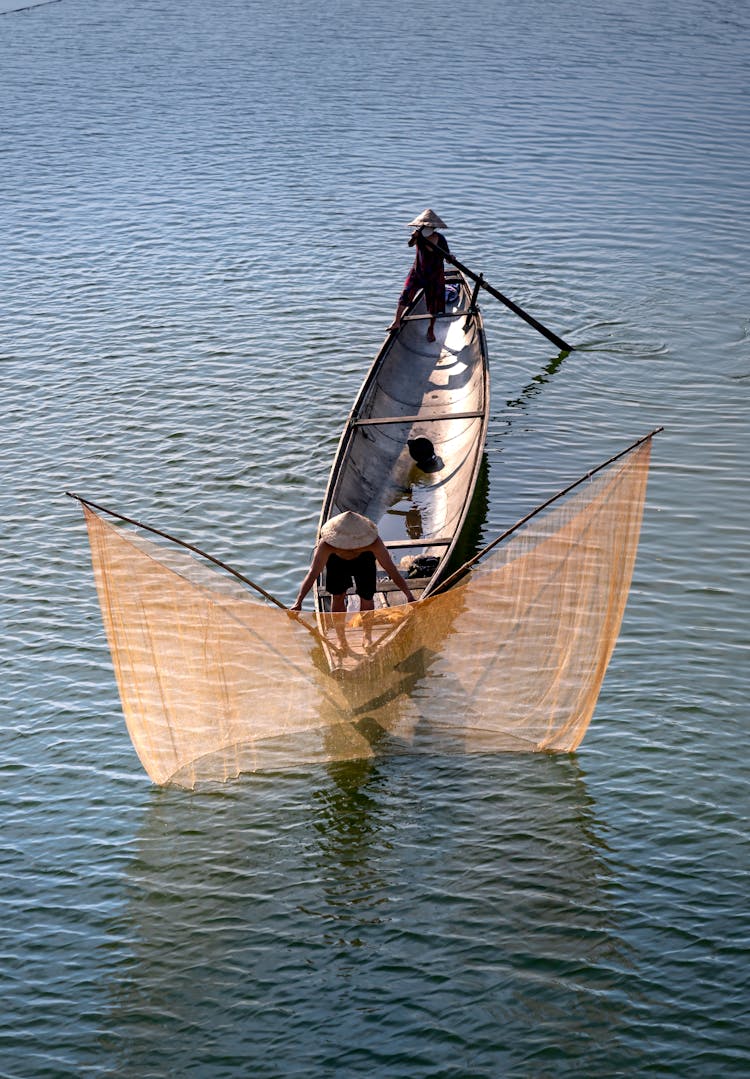 Fishermen On A Boat Fishing