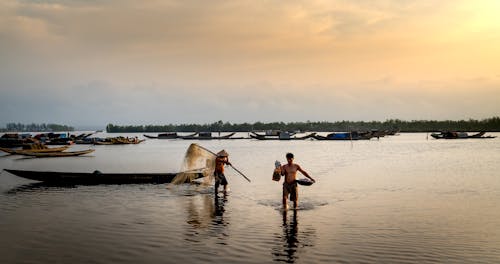 Fishermen in River at Dawn