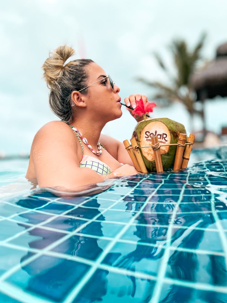 A Woman Drinking Coconut Juice