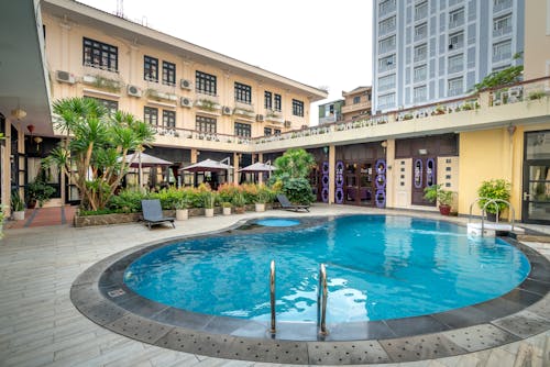 Swimming Pool Near Concrete Buildings