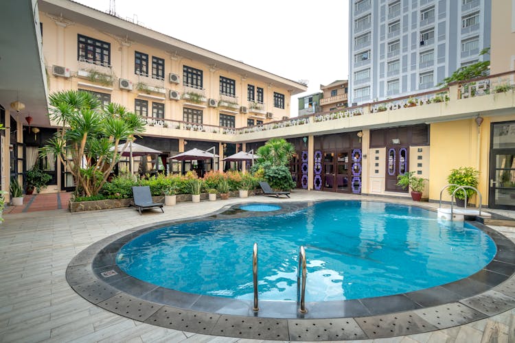 Swimming Pool Near Concrete Buildings