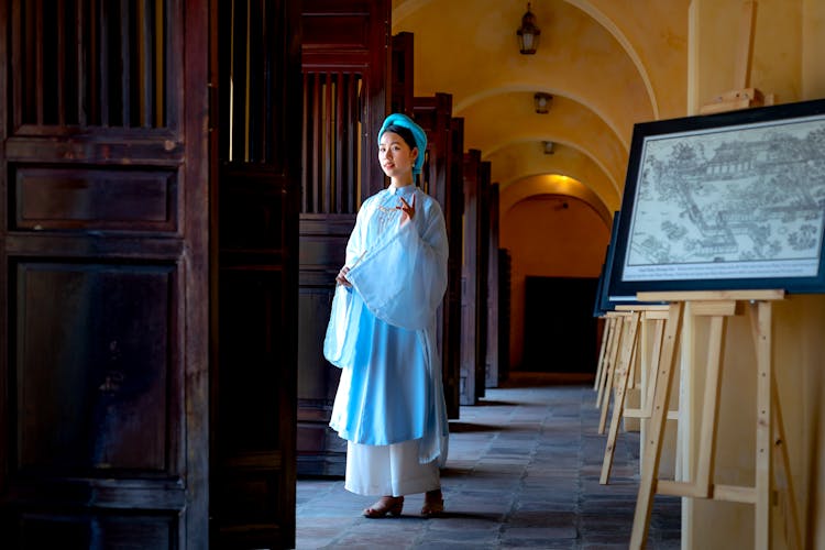 Woman Standing In A Hallway