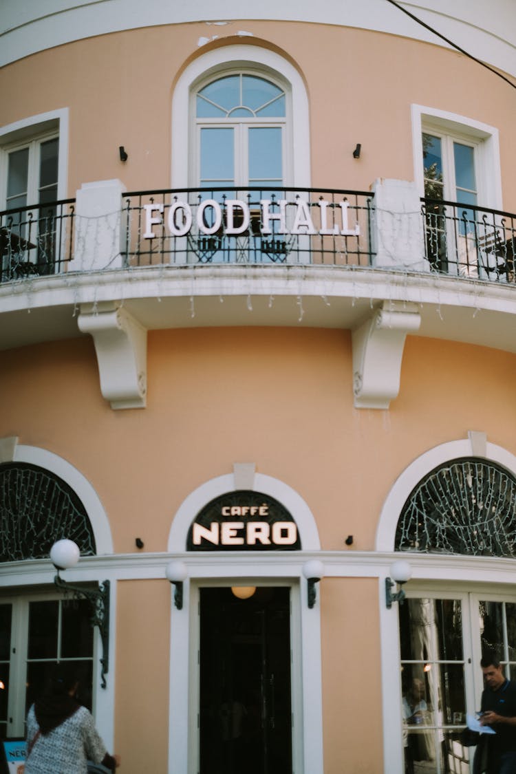 Food Hall Cafe Nero Signage On Outside Wall Of A Building