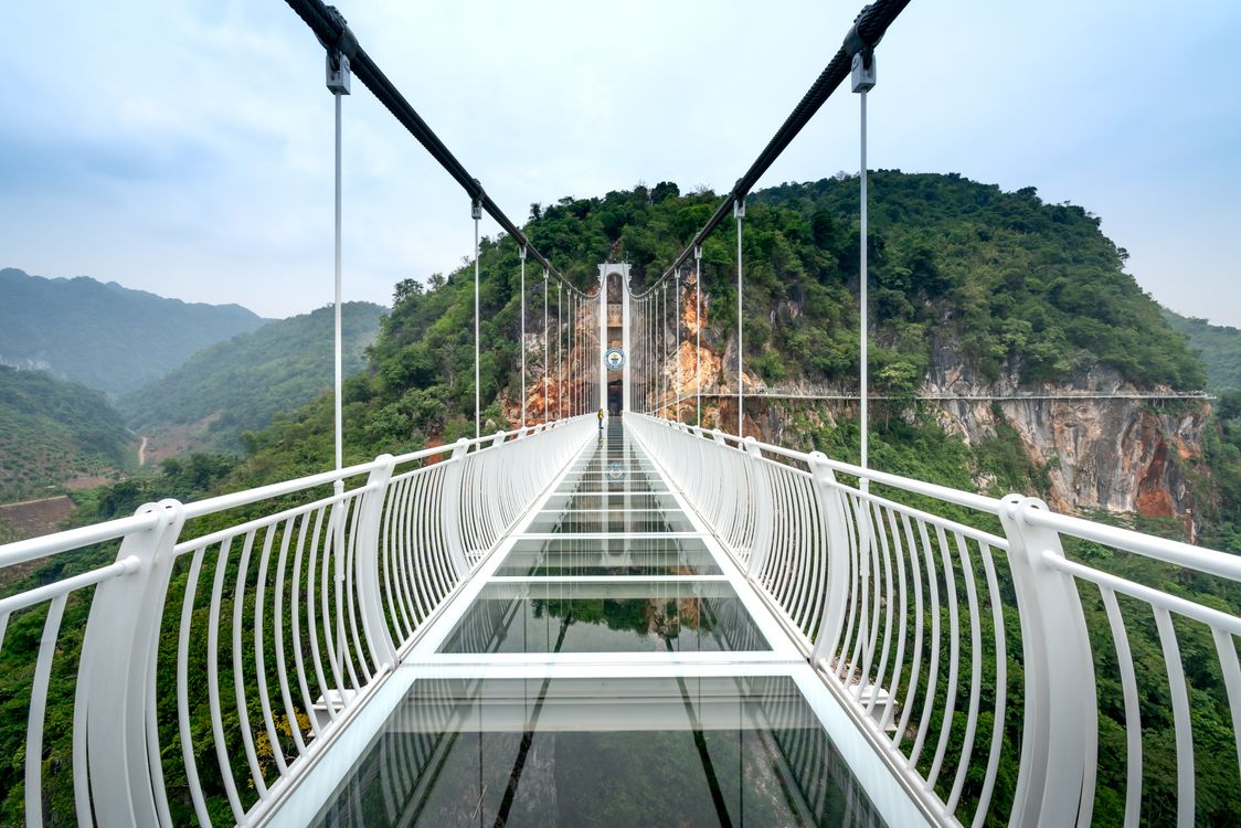 Glass Railing On Bridge Glass Bridge and White Steel Railing near Mountain · Free Stock Photo