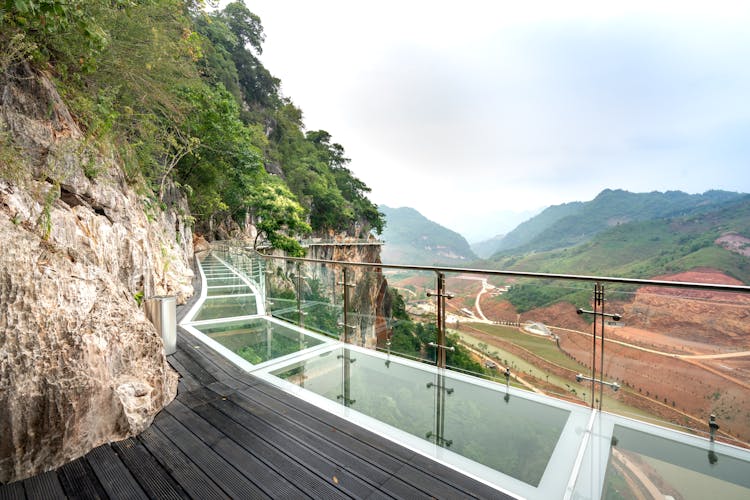 Bach Long Glass Bridge Overlooking A Rural Valley