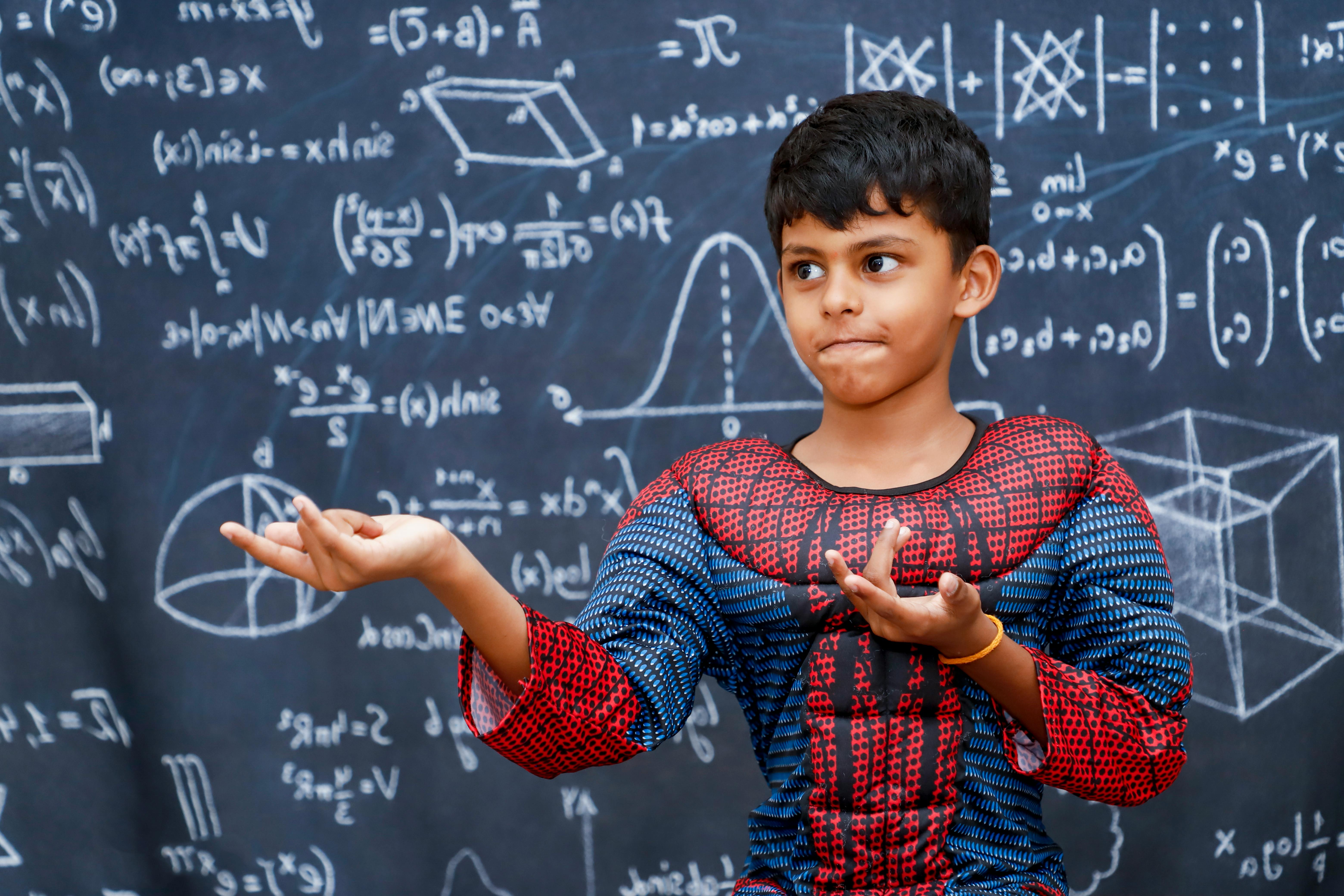 boy wearing spiderman costume