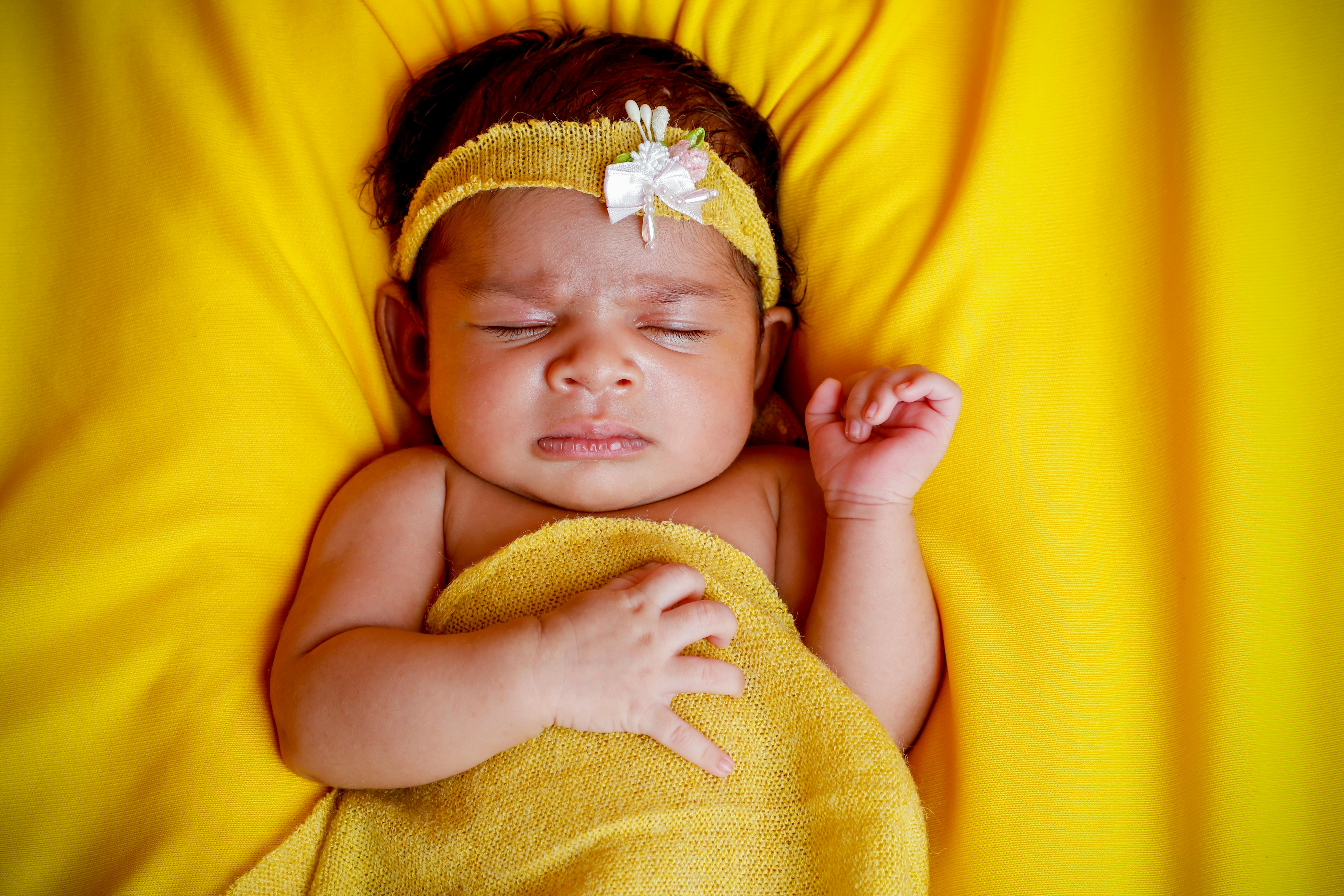Close-Up Shot of a Cute Newborn Baby · Free Stock Photo