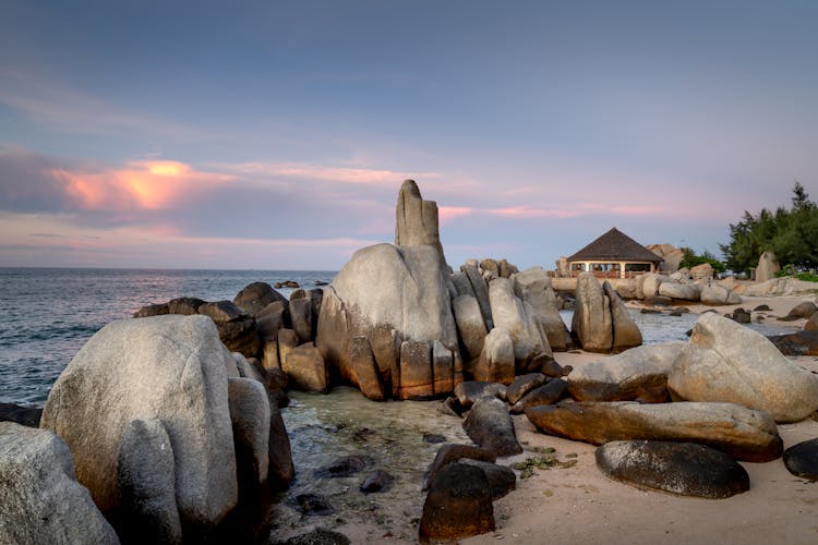 Rocks On The White Sand Beach