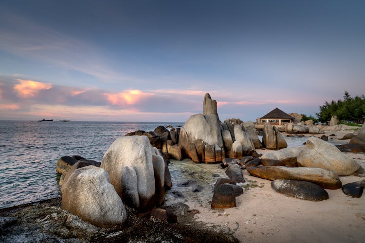 Rocks On The White Sand Beach