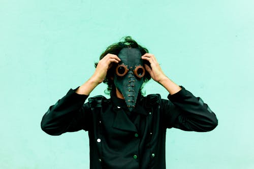 Man Wearing Mask on a Street 