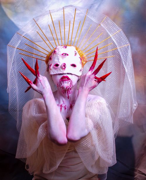 Free Intriguing fantasy portrait featuring eerie makeup and costume, perfect for Halloween themes. Stock Photo