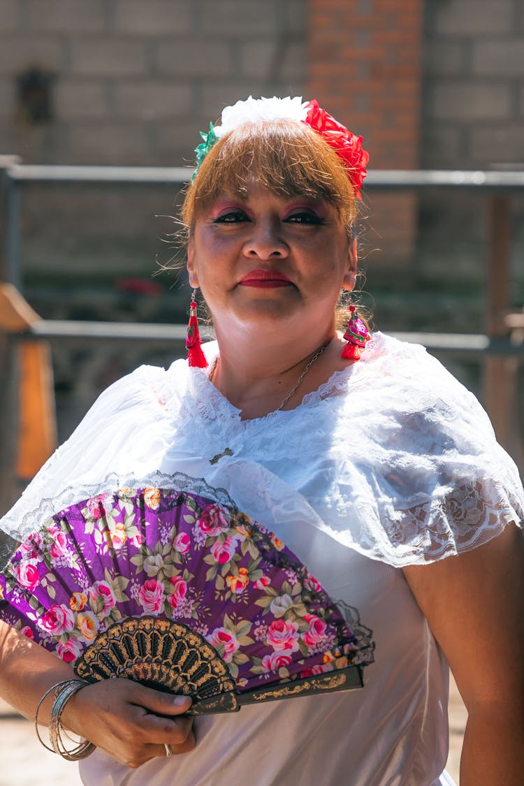 Woman Holding A Handheld Fan