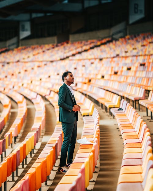 Man in Suit at Stadium