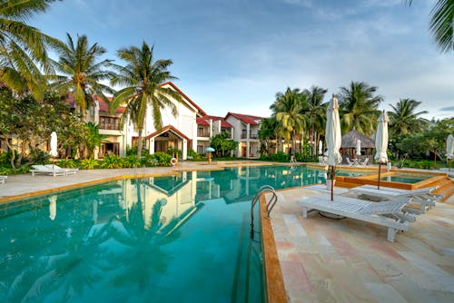 Luxurious Resort with Swimming Pool among Palm Trees