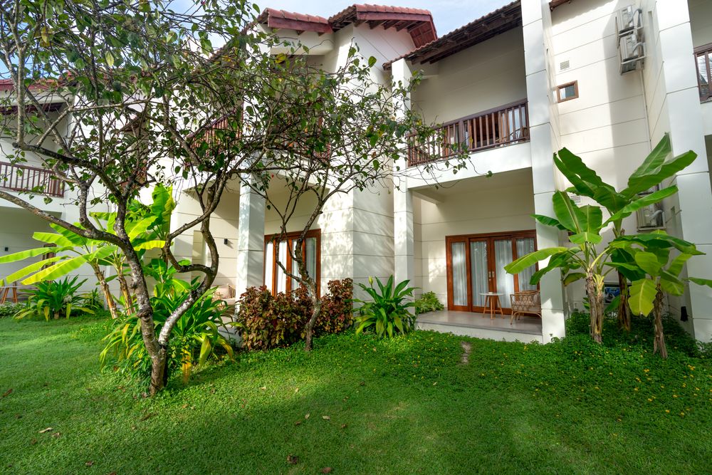 Lush green lawn of the farmhouse villa