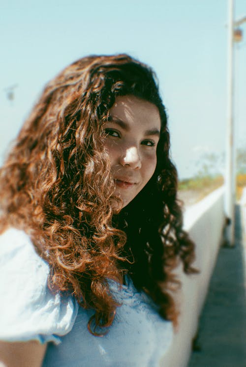 Close Up Photo of Woman Smiling