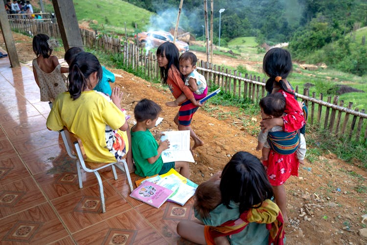 Children In A Mountain Village Reading Books