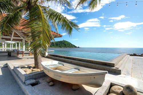 White Boat Beside a Swimming Pool