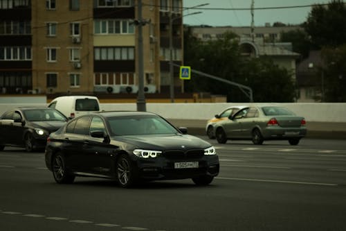 Vehicles on Gray Asphalt Road