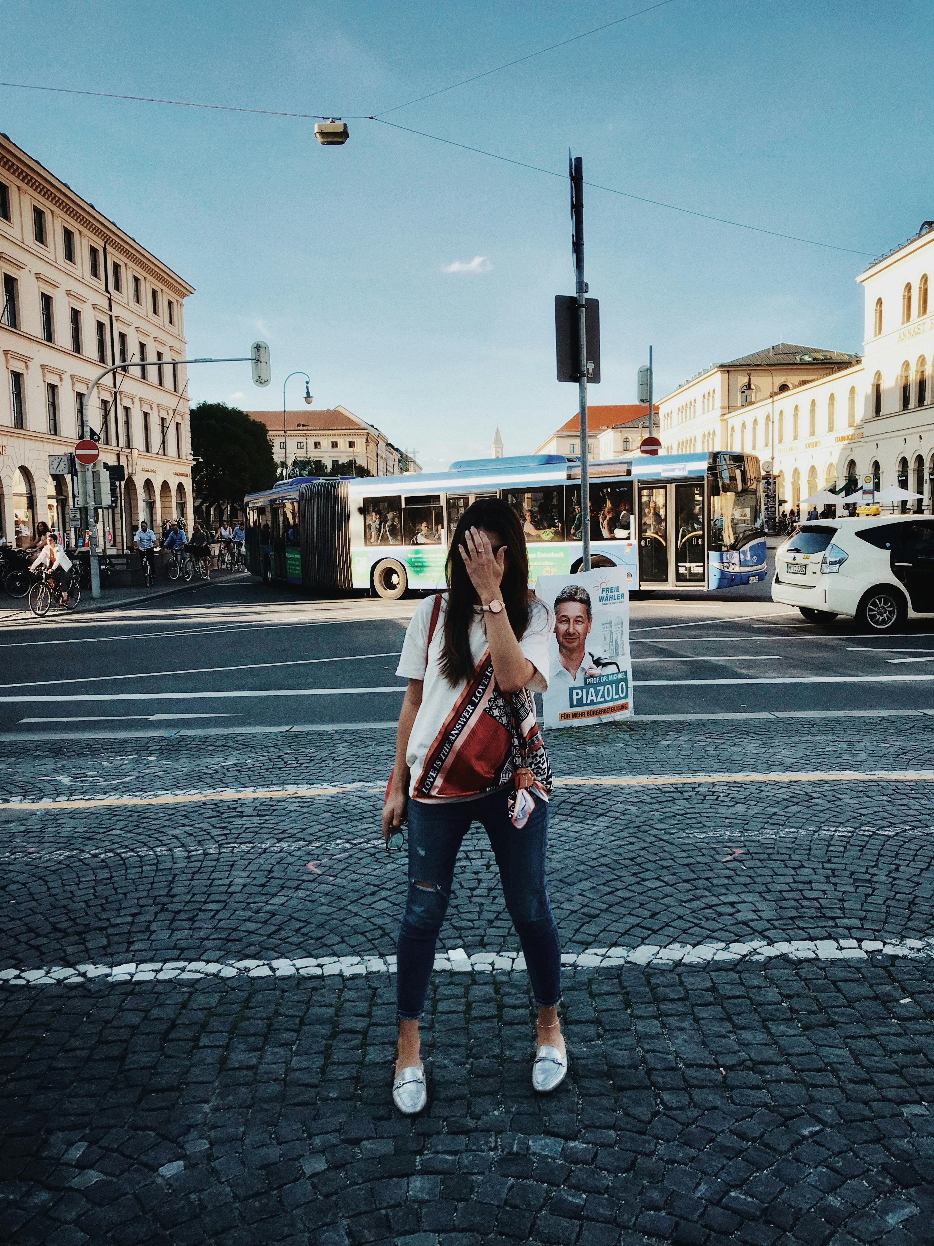 photo of woman covering her face