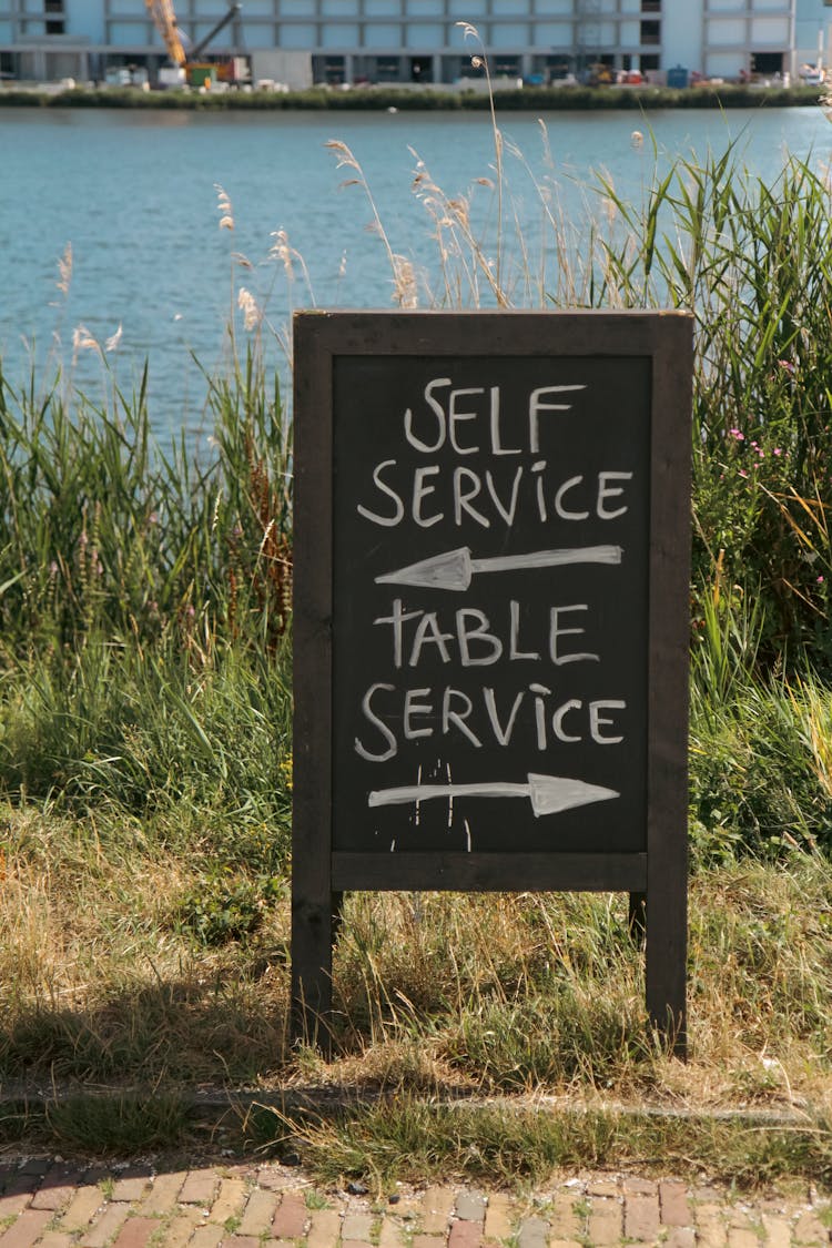 Sign Information Written On A Wooden Board