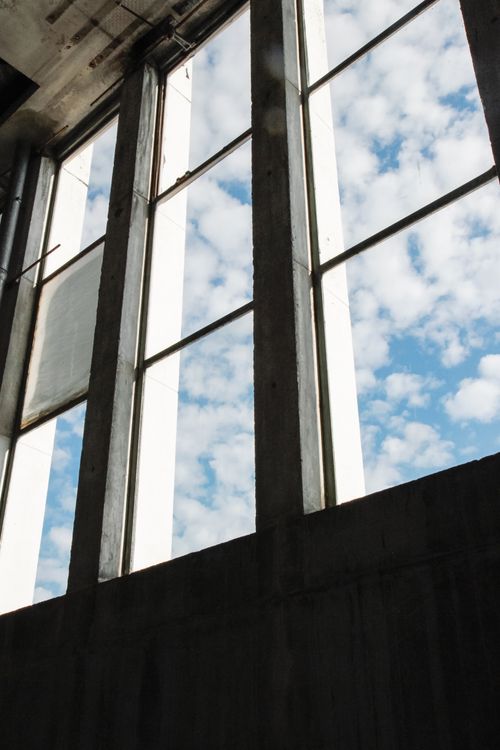 Free Captivating view from indoors of clouds through large windows in Zaandam, Netherlands. Stock Photo