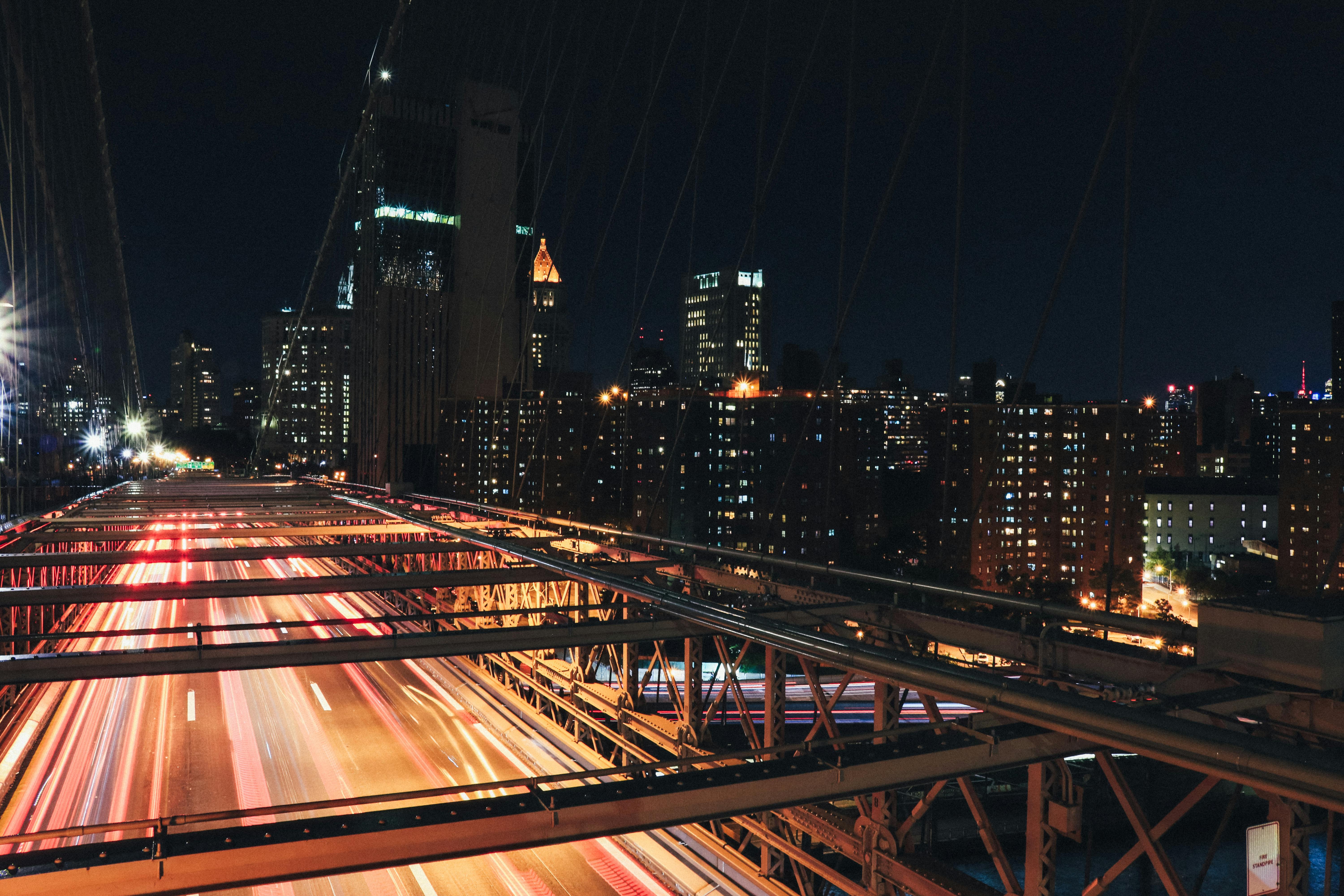 time lapse photography of bridge at nighttime