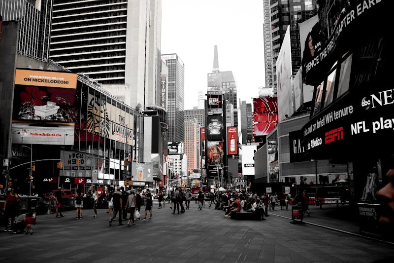 Dynamic scene of Times Square showcasing bustling urban life and iconic billboards in New York City.