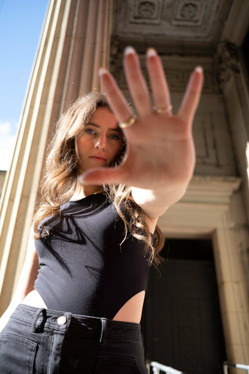 A Woman in Black Tank Top Showing Her Hand