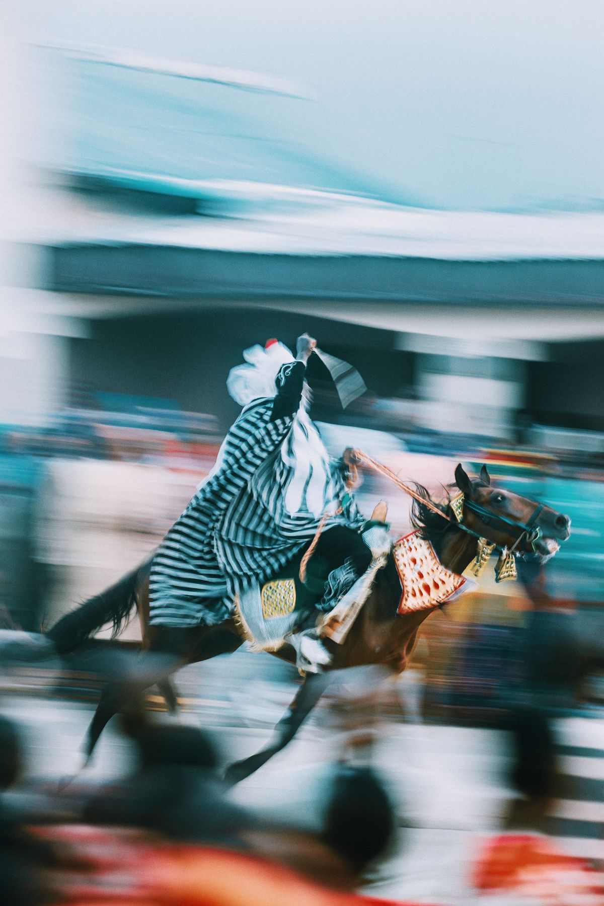 Rider galloping on a horse in a blurred-motion action shot