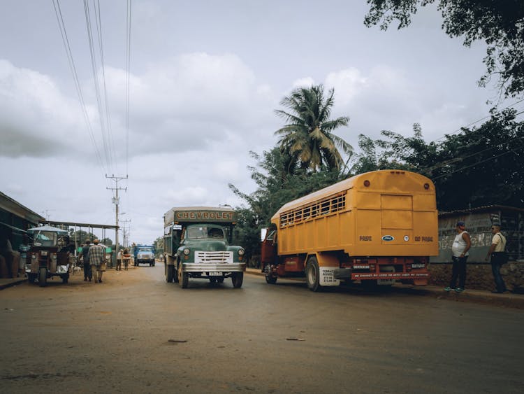 Retro Trucks On Street In City