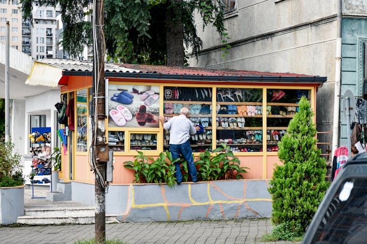 Man Near Booth In Town