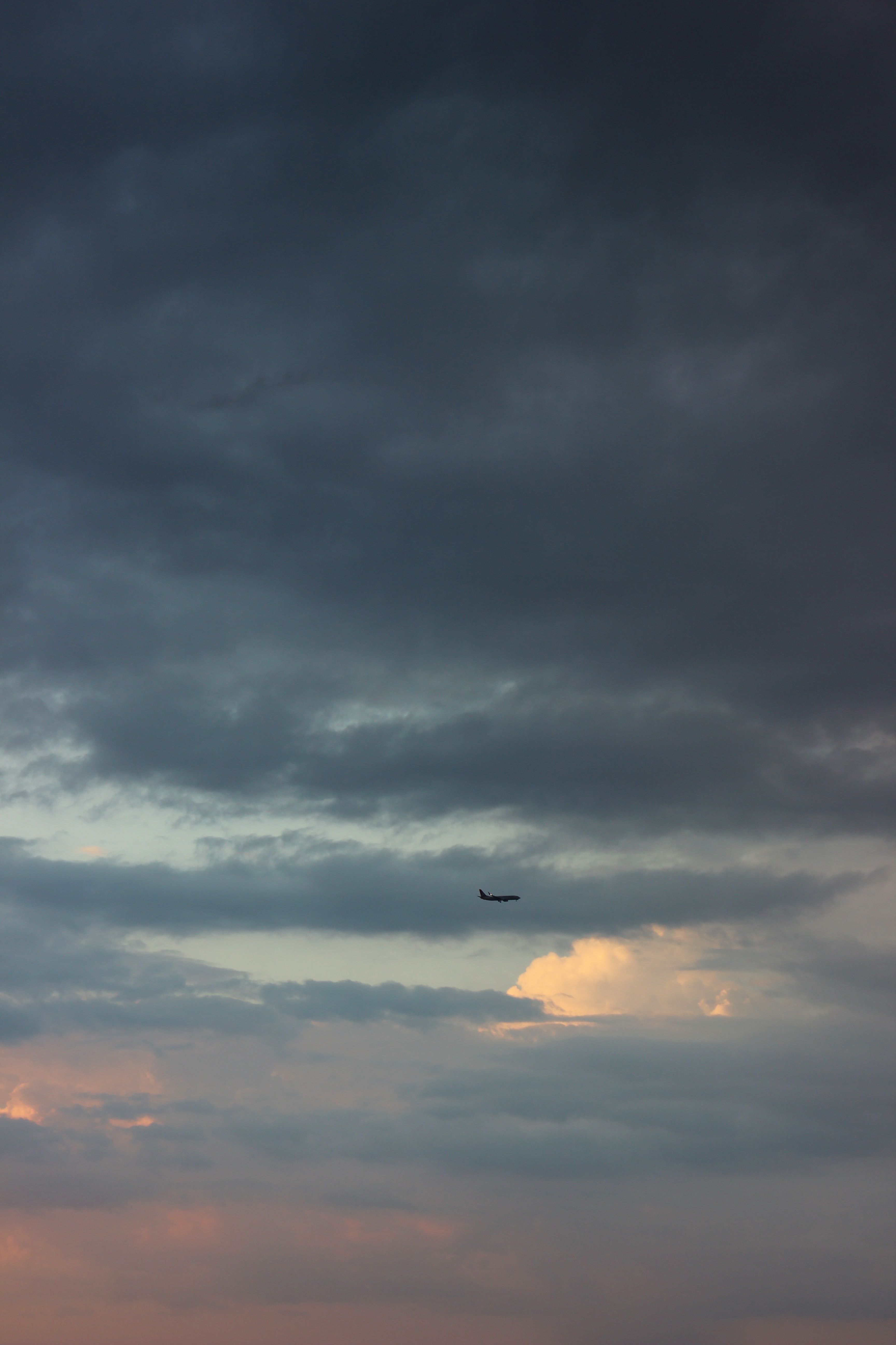 Flying Airplane on Sunset Sky · Free Stock Photo