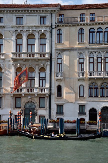 Explore the iconic canals of Venice with traditional gondolas against historic architecture.