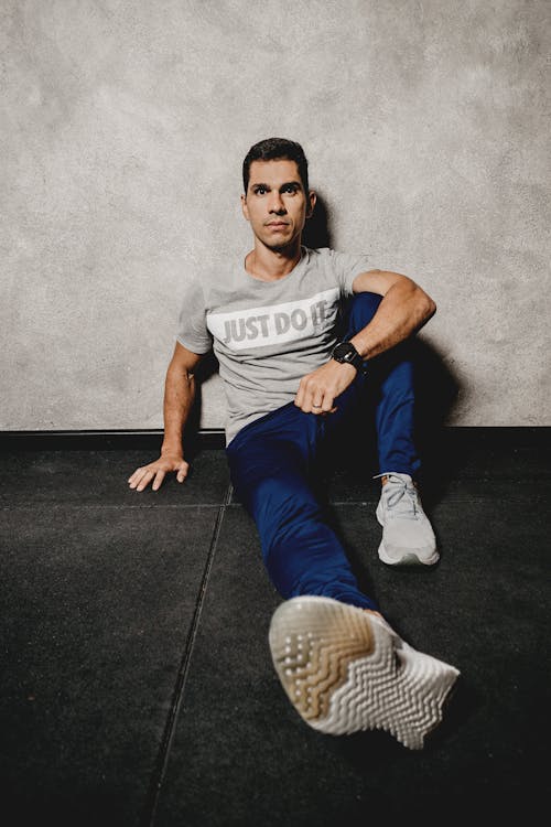 Man in Gray shirt Sitting on the Floor