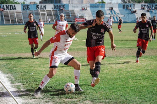 Photograph of Athletes Playing Football