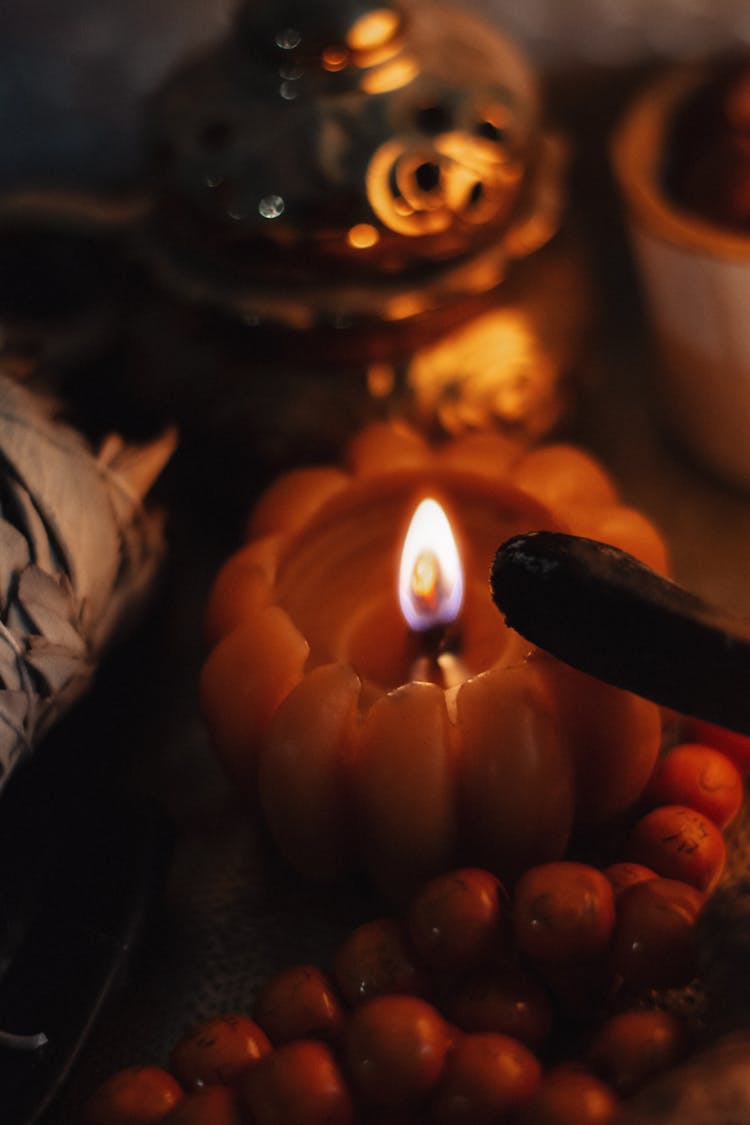 Lighted Candle On  Wooden Table