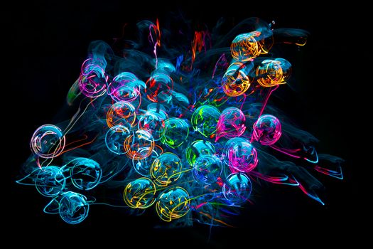 Colorful abstract light swirls create a futuristic and artistic design.
