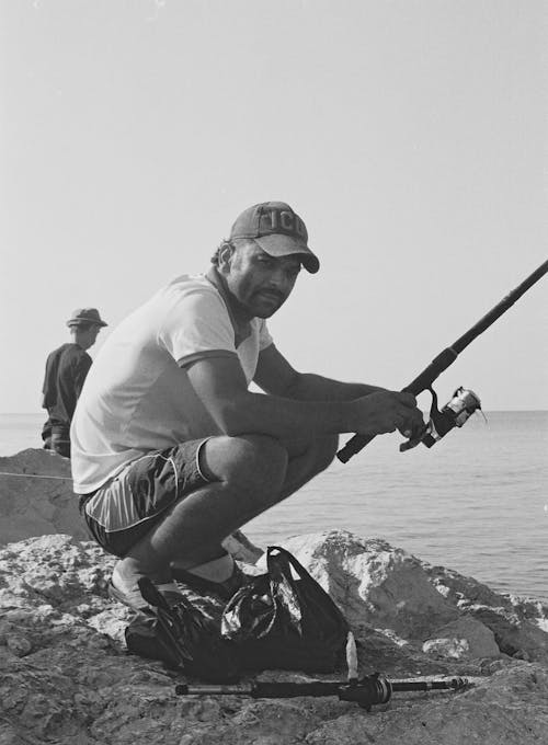 A Man Fishing on Sea