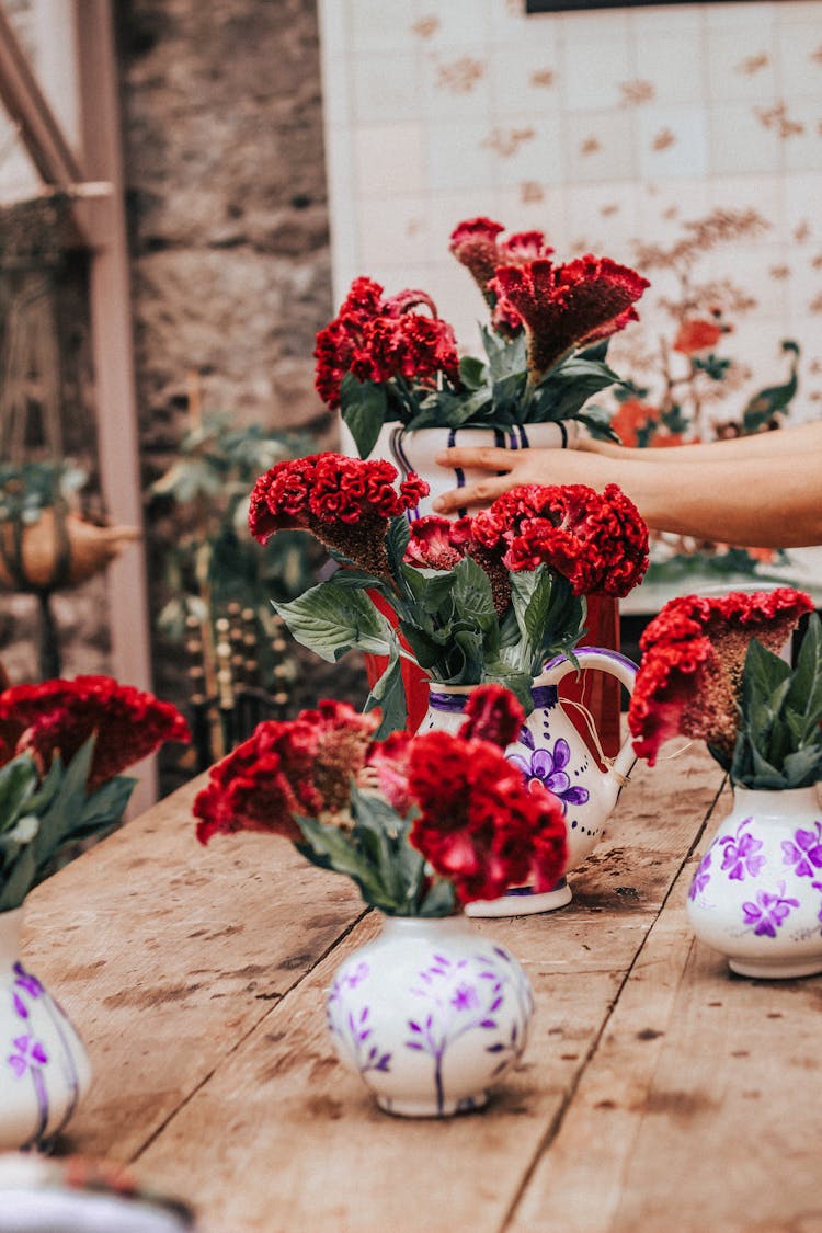 Woman Arranging Bouquets On The Table 