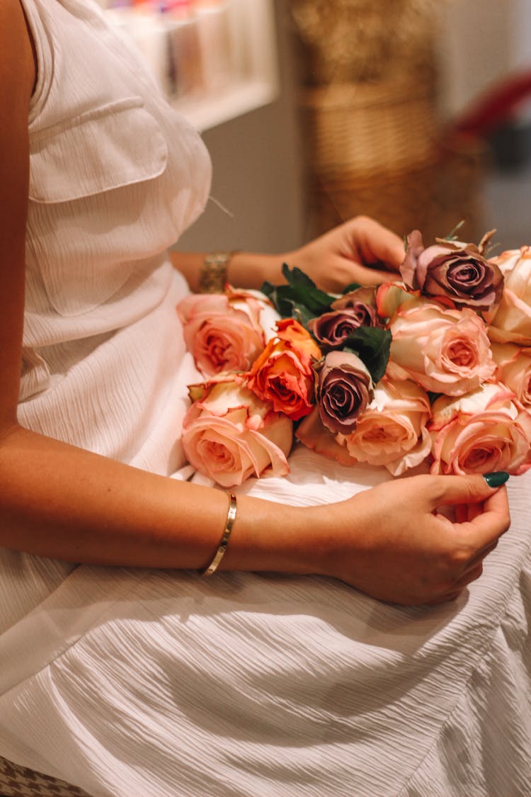 Woman Holding A Bouquet Of Roses