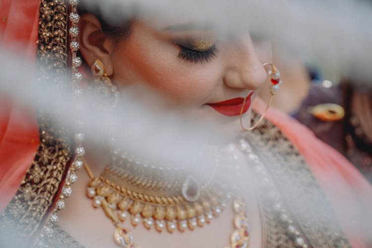 Woman Wearing Gold Jewelries